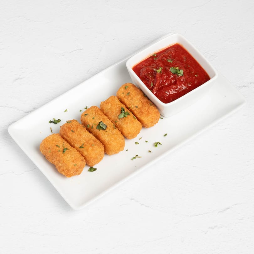 Five golden-brown mozzarella sticks with parsley flakes, served with a side of red marinara sauce.